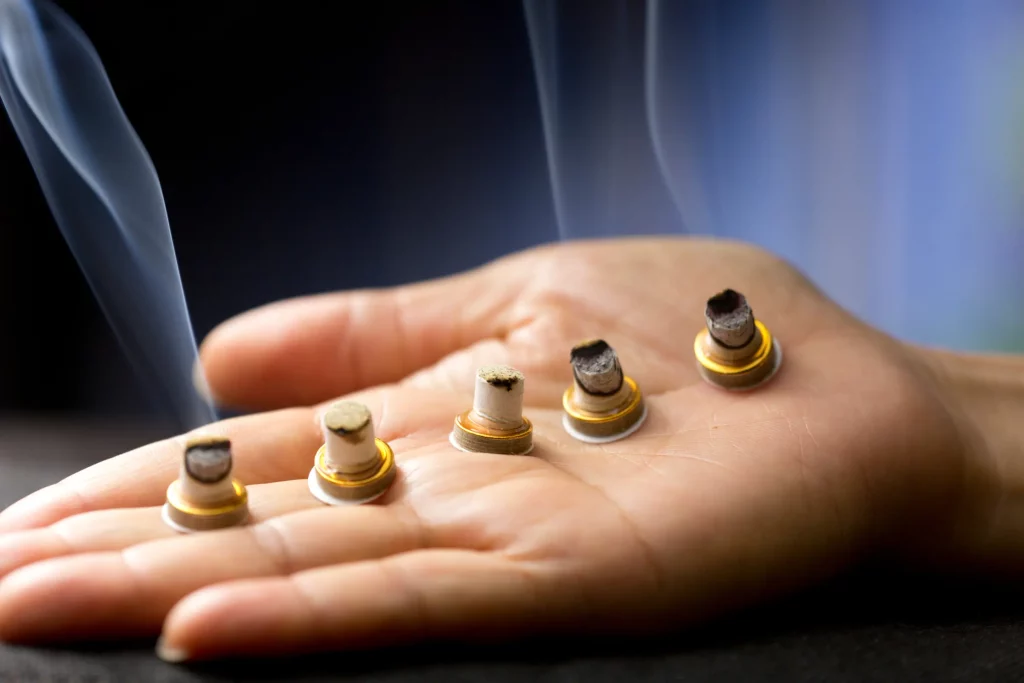 Indirect moxibustion heat therapy on acupuncture points in Freehold NJ